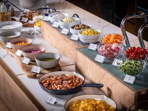 A buffet with various food items including chicken ham, mixed beans, carrots, and a bowl of sprouts. - Yadoya Uguisu (Tokyo)