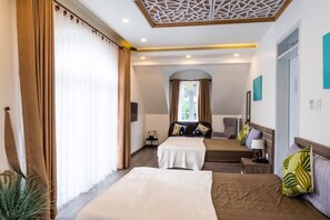 Standard Quadruple Room | Minibar, desk, blackout drapes, iron/ironing board - La Cle' Da Lat (Da Lat)