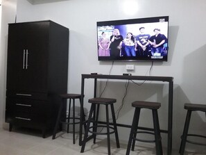 Basic Studio, 1 Double Bed with Sofa bed | Television - Condoluxe Pioneer Woodlands (Mandaluyong)