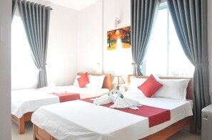 Habitación familiar | Minibar, escritorio, wifi gratis