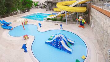 Seasonal outdoor pool, open 9:00 AM to 6:00 PM, pool umbrellas
