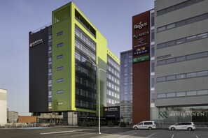 A modern building with multiple businesses including 'Regus' and 'Kupitta'. - Original Sokos Hotel Kupittaa (Turku)