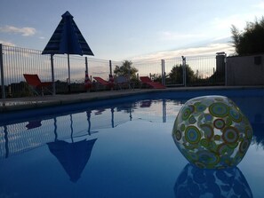 Seasonal outdoor pool, pool umbrellas, pool loungers