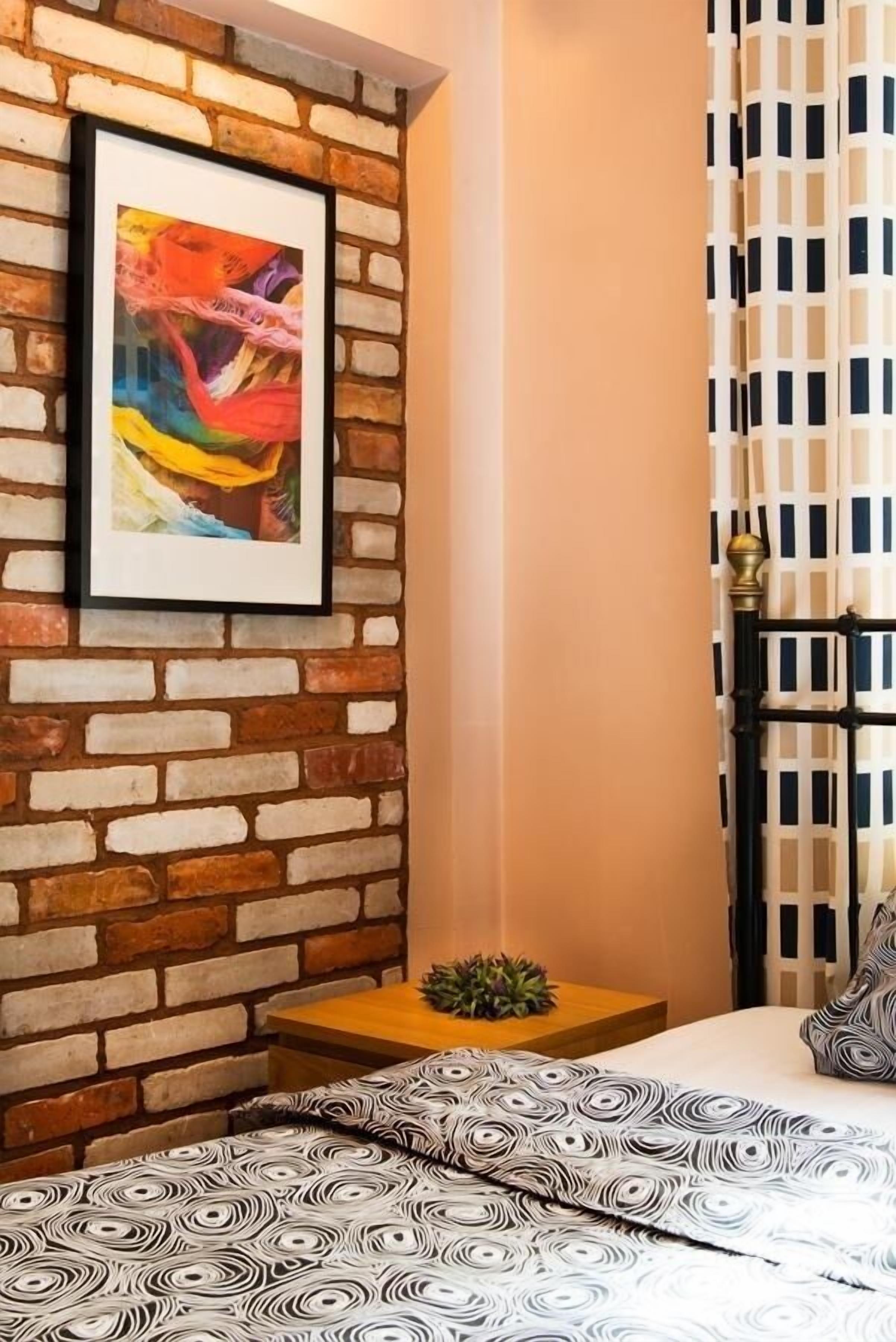 comfort apartment, courtyard view | hypo-allergenic bedding, laptop workspace, iron/ironing board