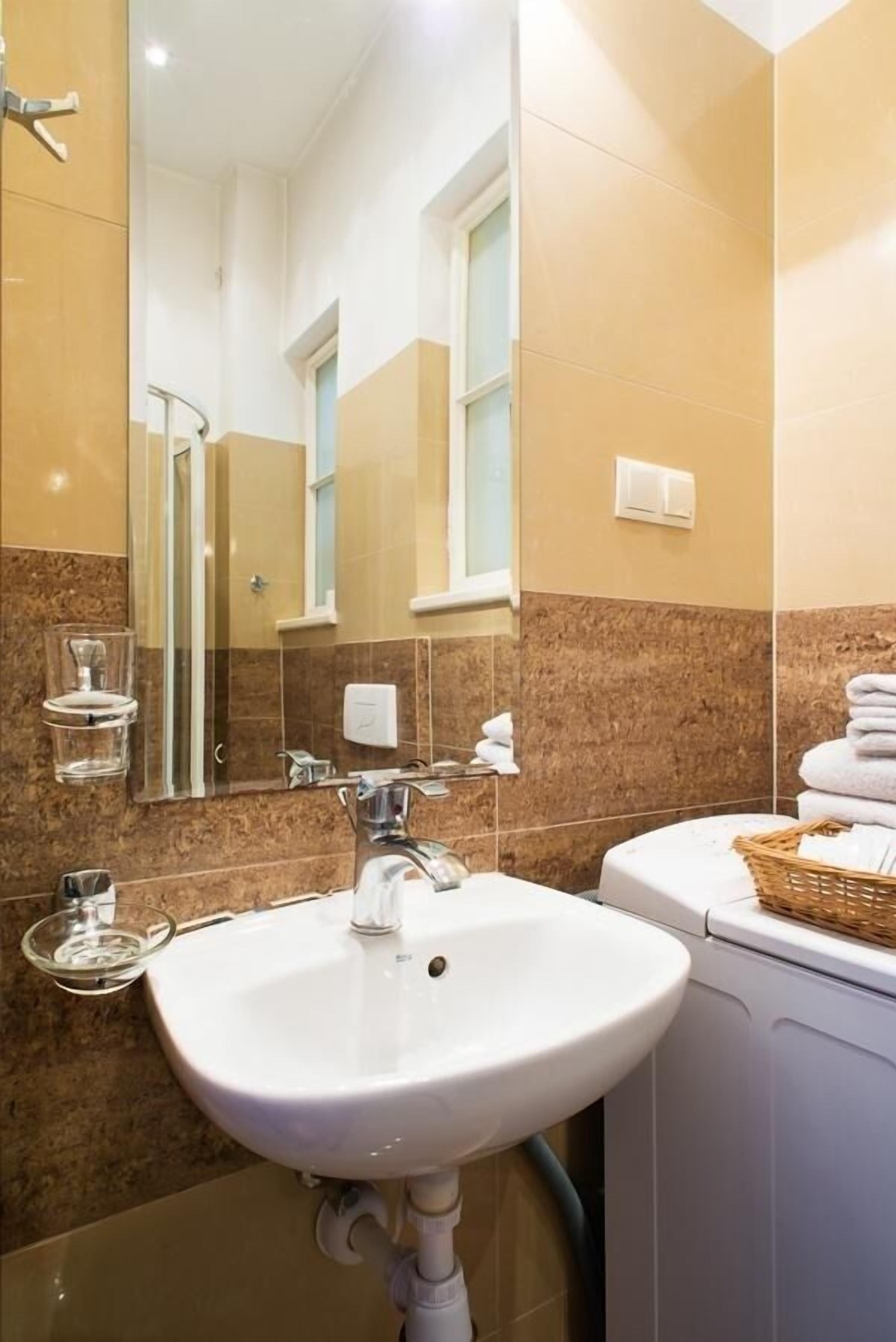 comfort apartment, courtyard view | bathroom | free toiletries, hair dryer, towels, soap