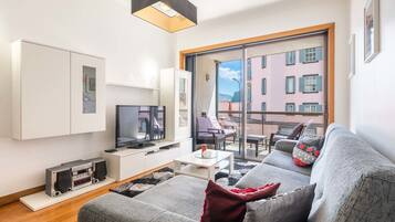 Apartment, 2 Bedrooms, Balcony | Living area | Flat-screen TV, DVD player