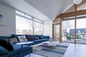 Deluxe Chalet (A) | Living area | 55-inch Smart TV with cable channels, TV, Netflix