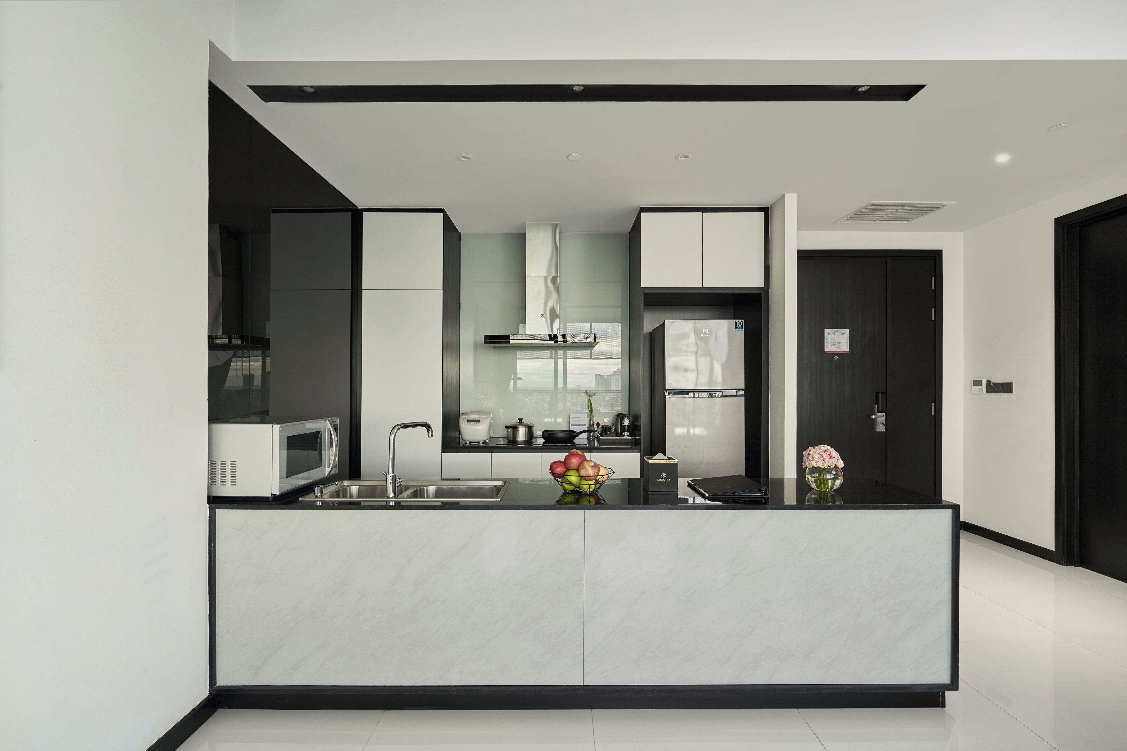 executive residence | private kitchenette | mini-fridge, eco-friendly cleaning products, freezer, paper towels