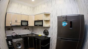 Comfort Apartment | Private kitchen | Full-size fridge, microwave, stovetop, electric kettle