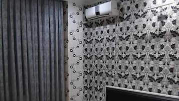 Apartamento conforto | Cortinas blackout, ferros/tábuas de passar roupa