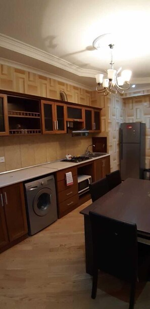 Comfort Apartment | Private kitchen | Fridge, microwave, oven, stovetop