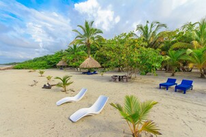 On the beach, free beach cabanas, beach umbrellas, beach towels