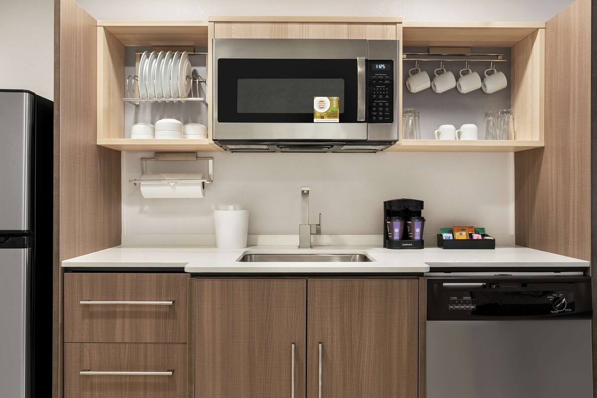 full-sized fridge, microwave, dishwasher, coffee/tea maker