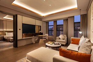 Suite, 1 Bedroom | Living area | 50-inch flat-screen TV with digital channels, TV