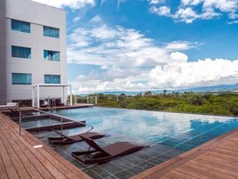 Outdoor pool, open 6:00 AM to 8:00 PM, pool loungers