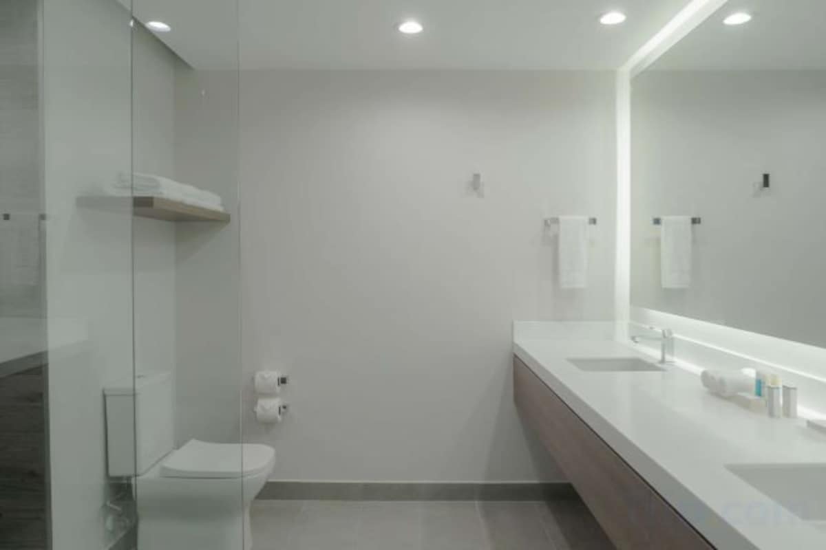 Shower, designer toiletries, hair dryer, towels