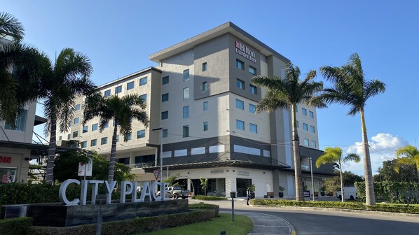 A multi-story hotel with a modern design, featuring a prominent 'City Place' sign at the entrance. - Hilton Garden Inn Santa Ana San Jose (Santa Ana)