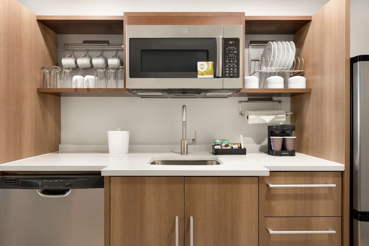 full-sized fridge, microwave, stovetop, dishwasher