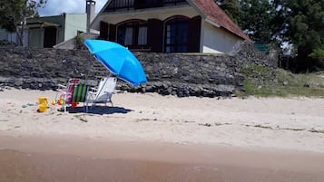 On the beach, sun-loungers