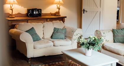 Charming detached flint cottage on village green, 5 minute stroll to beach