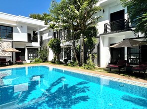 Outdoor pool, open 7:00 AM to 11:00 PM, pool umbrellas, sun loungers