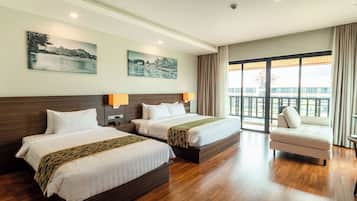 Family Triple Room | Minibar, in-room safe, individually furnished, desk