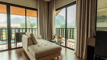 Family Triple Room | Minibar, in-room safe, individually furnished, desk