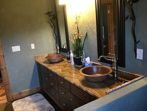 Bathtub, hair dryer, towels, toilet paper
