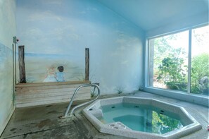 Relax by the pool surrounded by a clear view of the outdoors.