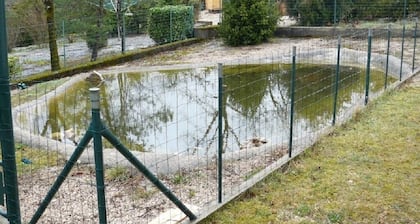 Maison spacieuse avec grand jardin clÎturé