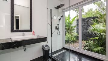 Combined shower/tub, hair dryer, towels, soap