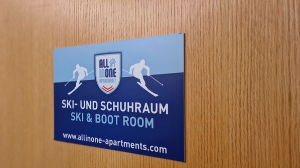A sign for 'All In One Apartments' featuring ski and boot room amenities. - Post Residence Apartments 12B, terrace,SUMMER CARD (Zell am See)