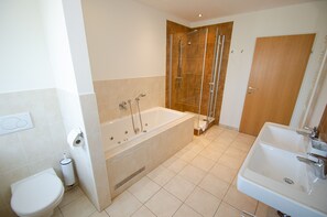 Bathtub, hair dryer, towels
