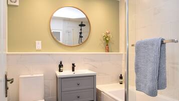 Bathtub, hair dryer, towels, soap