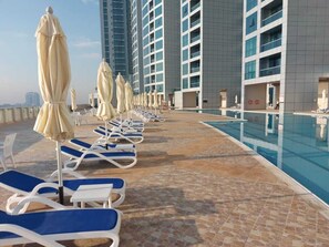 Outdoor pool, a heated pool - Luxury 1 BR Beach Apartment with Full Sea View (Ajman)