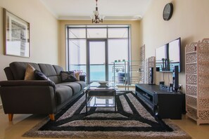 Smart TV, DVD player, books, stereo - Luxury 1 BR Beach Apartment with Full Sea View (Ajman)
