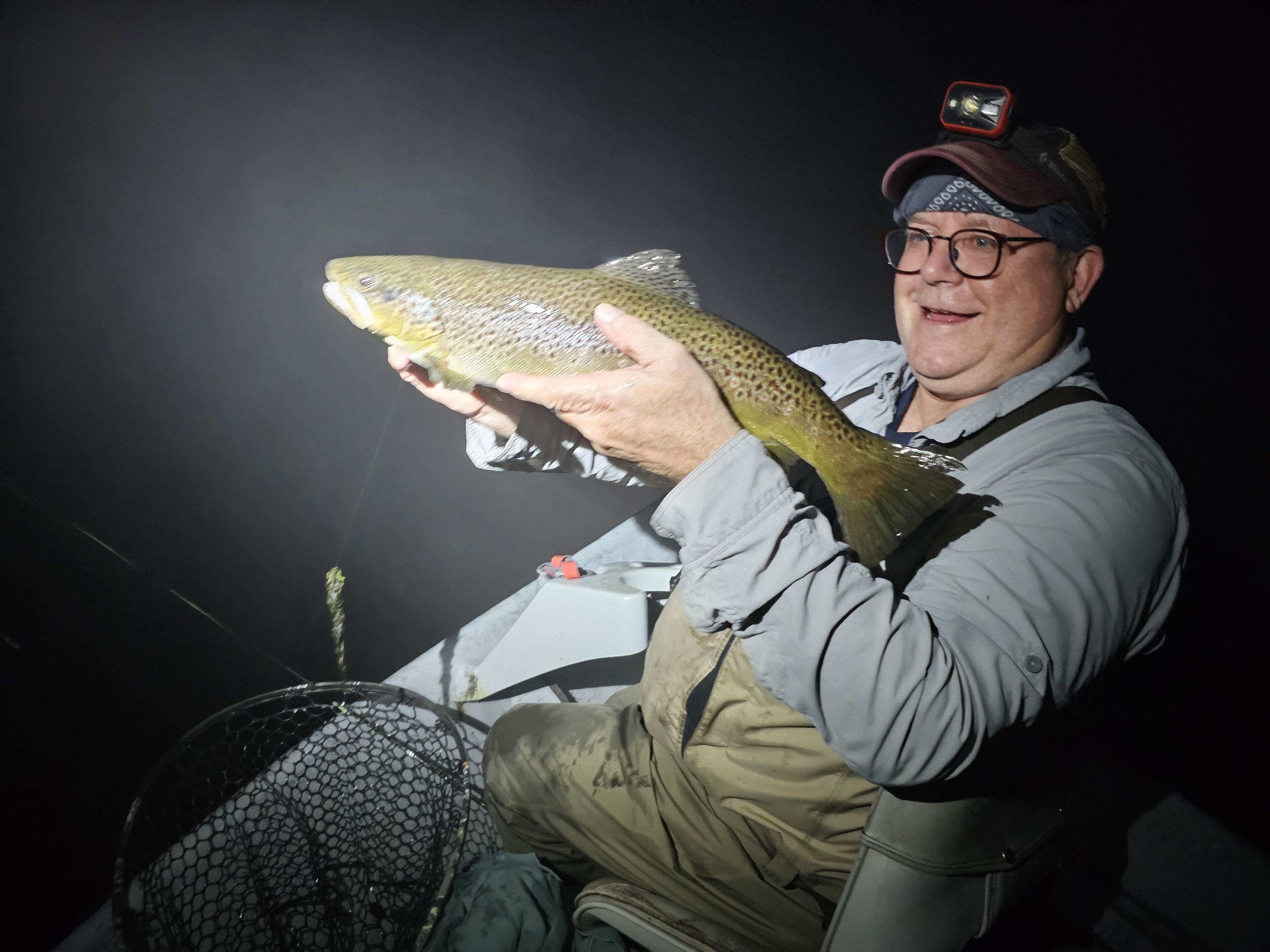 A person holding a fish.