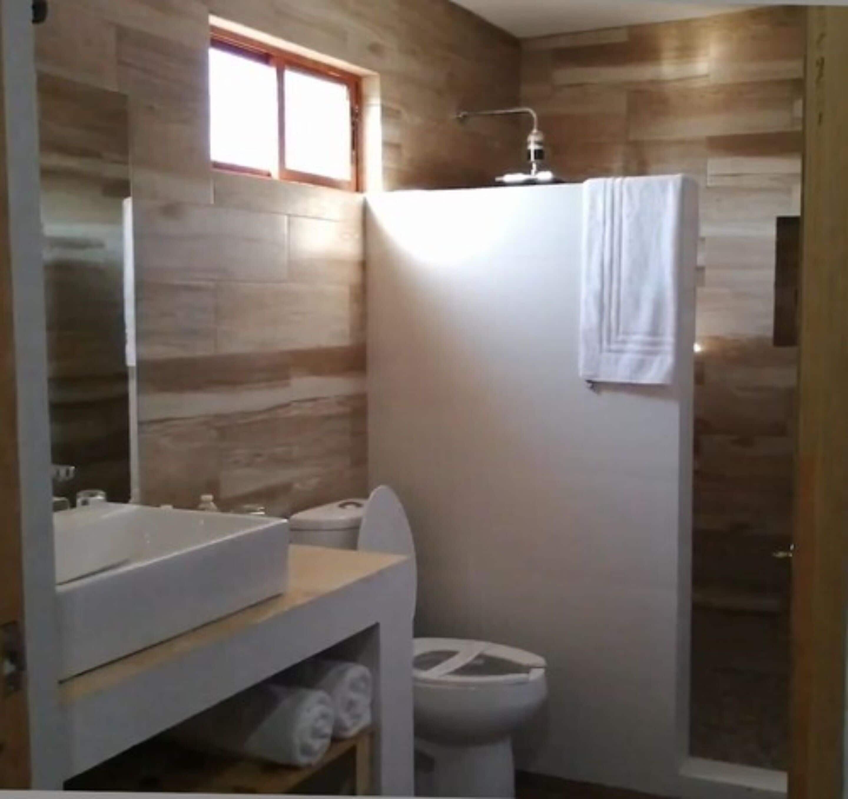 deluxe twin room, beach view | bathroom | shower, free toiletries, towels, soap