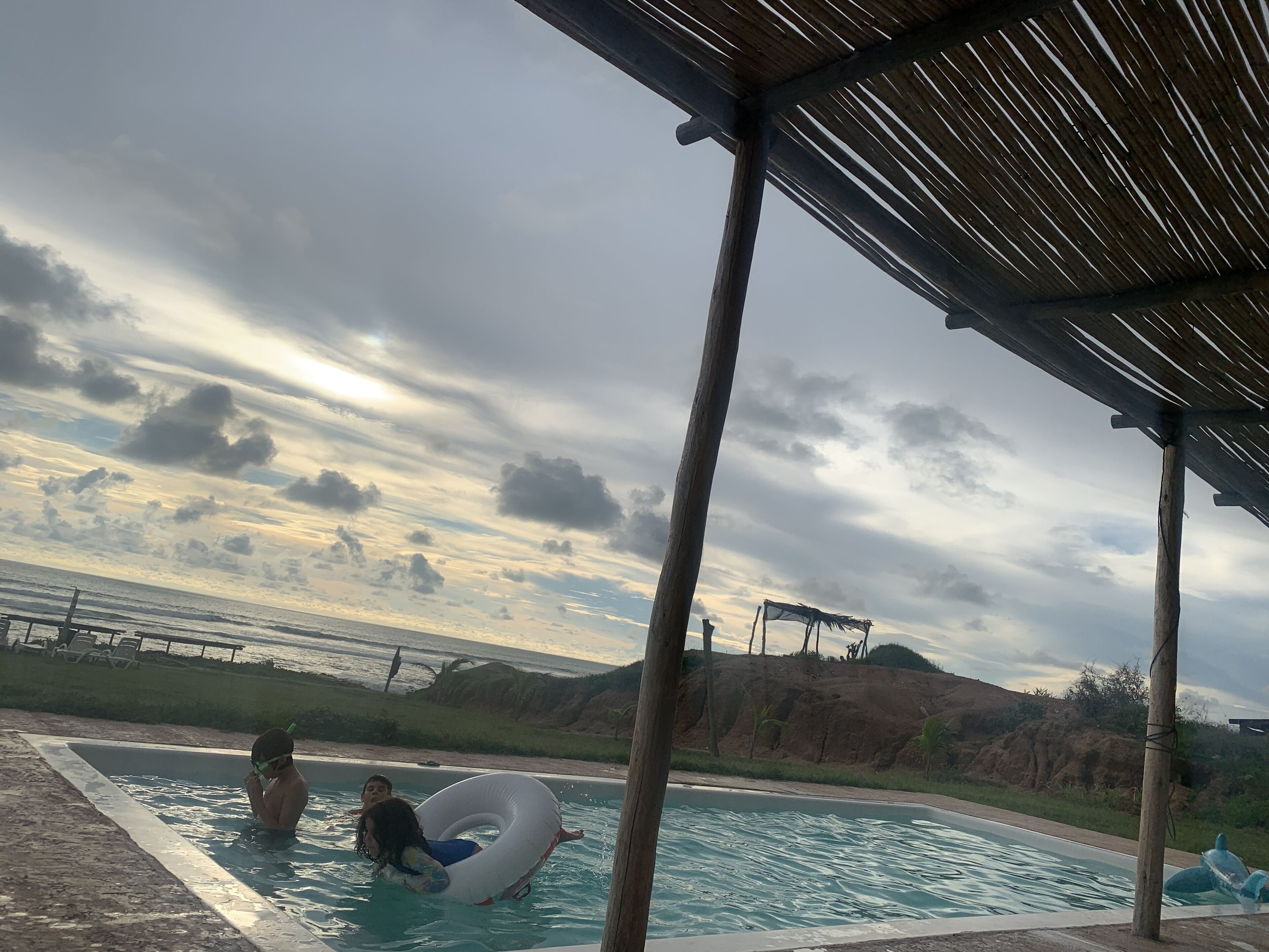 outdoor pool, open 8:00 am to 8:00 pm, pool umbrellas, pool loungers