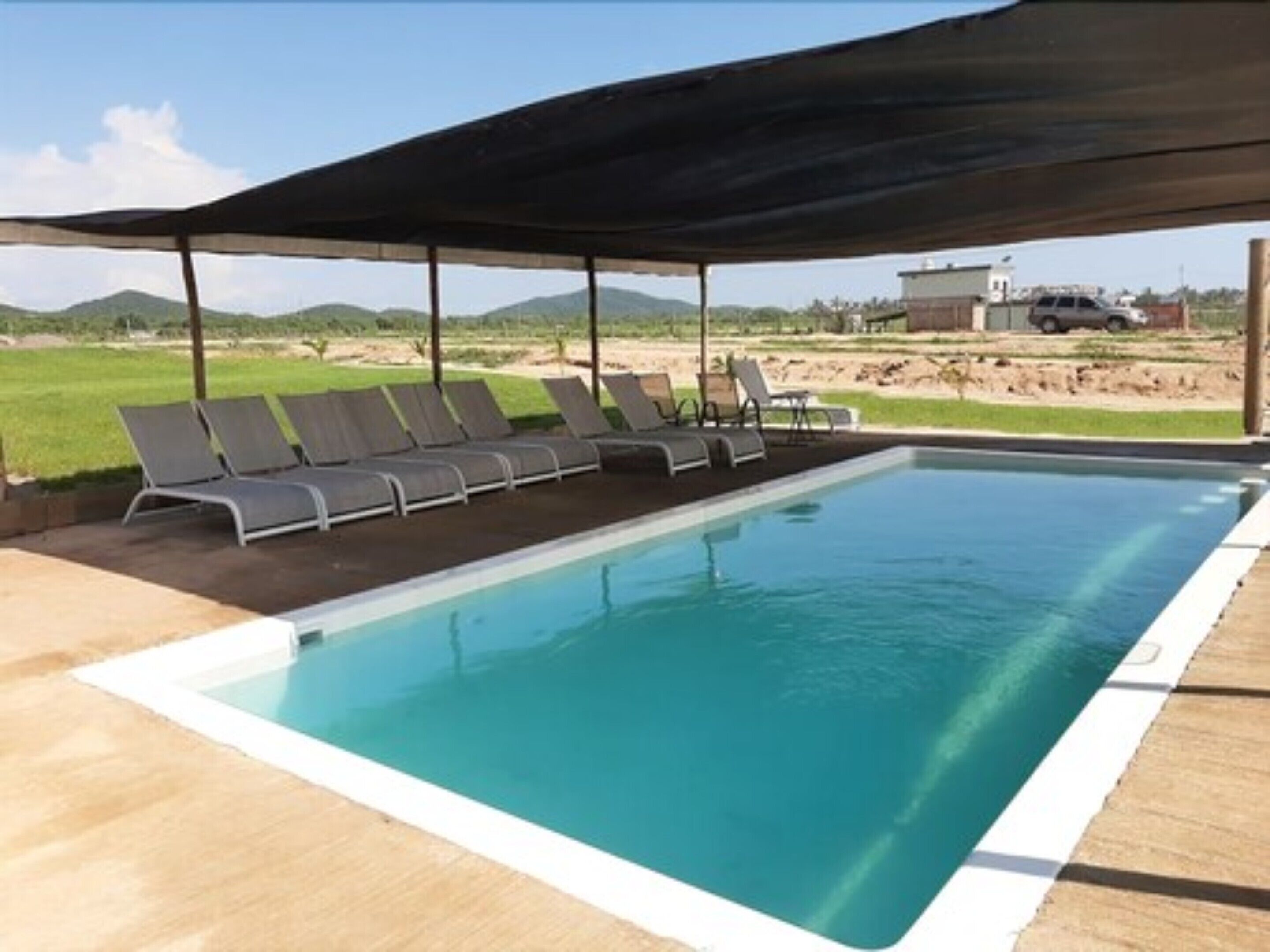 outdoor pool, open 8:00 am to 8:00 pm, pool umbrellas, pool loungers