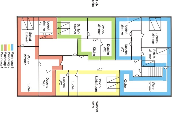 A hotel floor plan with multiple rooms, including bedrooms, bathrooms, and a kitchen area.
