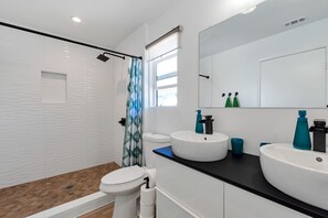 Shower, hair dryer, towels, toilet paper