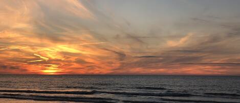 On the beach, sun-loungers, beach towels