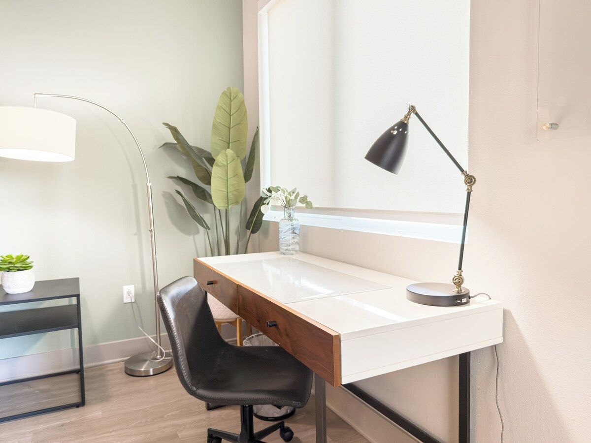 Dedicated workspace with a desk and task lighting