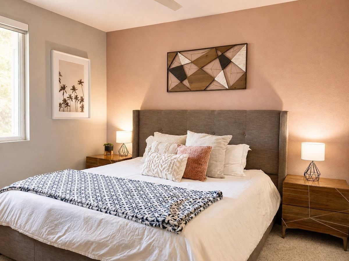 Inviting second bedroom with a comfortable bed and warm decor, a restful space