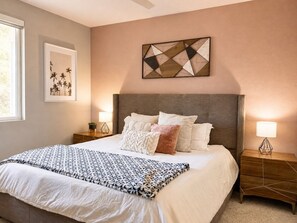Inviting second bedroom with a comfortable bed and warm decor, a restful space - Resort-Style 2bed Condo 3 Miles to Disney (Fullerton)