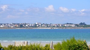 A coastal town with houses along the shoreline, a sandy beach, and a clear blue sky. - CHARMING APARTMENT ⭐️⭐️⭐️⭐️ WITH SWIMMING POOL BEAUTIFUL SEA VIEW 150 M FROM SANDY BEACH (SIBIRIL)