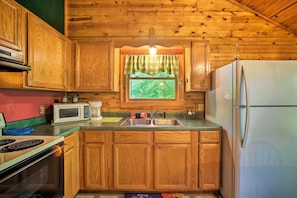 Fridge, microwave, stovetop, coffee/tea maker