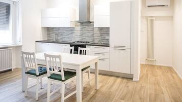 Fridge, oven, dishwasher, dining tables