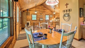 A wooden interior with a dining table set for four, surrounded by chairs. - Secluded Studio 1 mi to Thorncrown Chapel (Eureka Springs)
